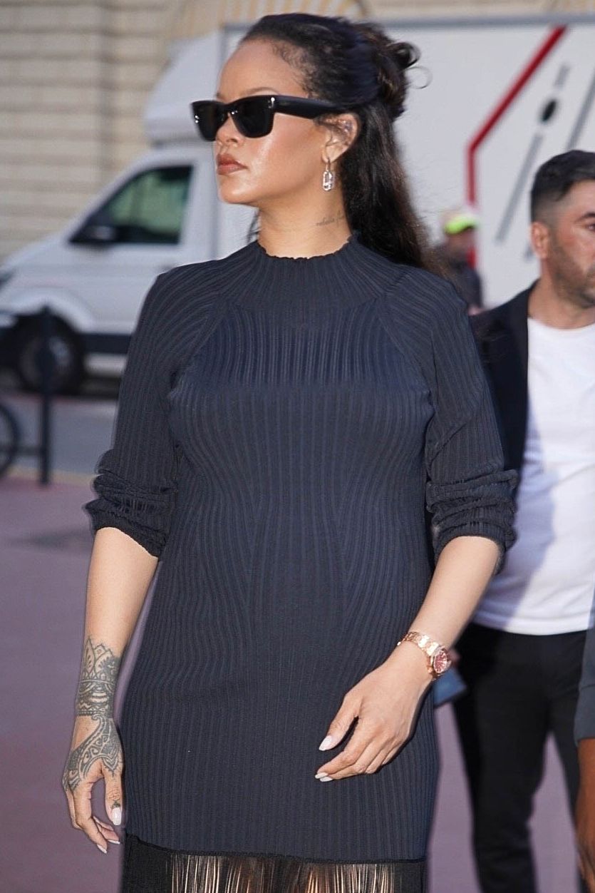 Rihanna braves the media frenzy in Cannes during a solo retail therapy session, and enters to a Messika store.