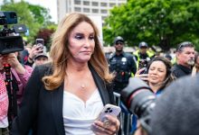 US media personality Caitlyn Jenner (C) is confronted by pro-Palestinian protestors demonstrate outside the White House Correspondents