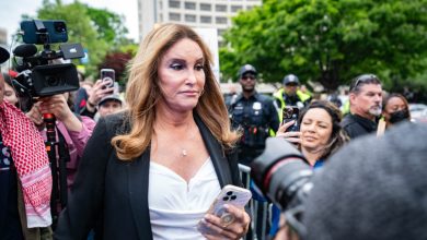 US media personality Caitlyn Jenner (C) is confronted by pro-Palestinian protestors demonstrate outside the White House Correspondents