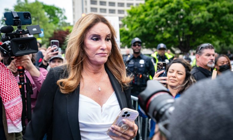 US media personality Caitlyn Jenner (C) is confronted by pro-Palestinian protestors demonstrate outside the White House Correspondents