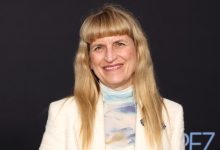 Catherine Hardwicke attends the premiere of Emilia Perez in a white blazer and multi-colored turtleneck.