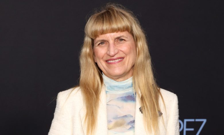 Catherine Hardwicke attends the premiere of Emilia Perez in a white blazer and multi-colored turtleneck.