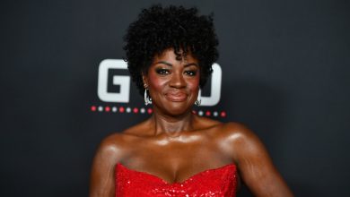 Viola Davis attends the L.A. premiere of Amazon MGM Studios’ ‘G20’ at Hollywood’s TCL Chinese Theater while wearing a sequined red gown and silver earrings.