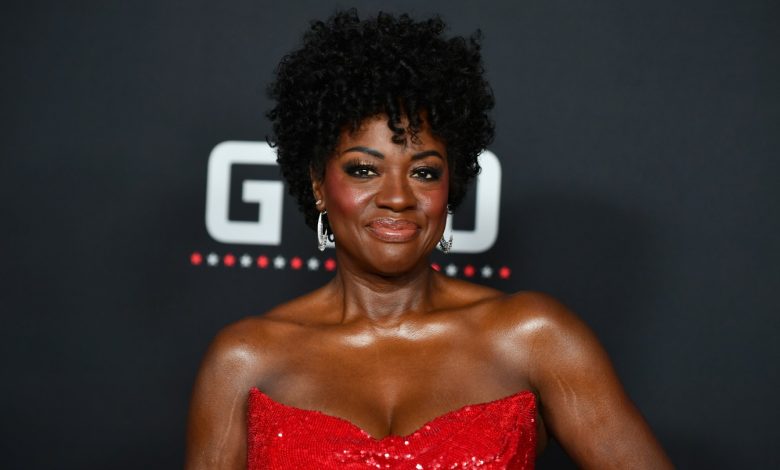 Viola Davis attends the L.A. premiere of Amazon MGM Studios’ ‘G20’ at Hollywood’s TCL Chinese Theater while wearing a sequined red gown and silver earrings.