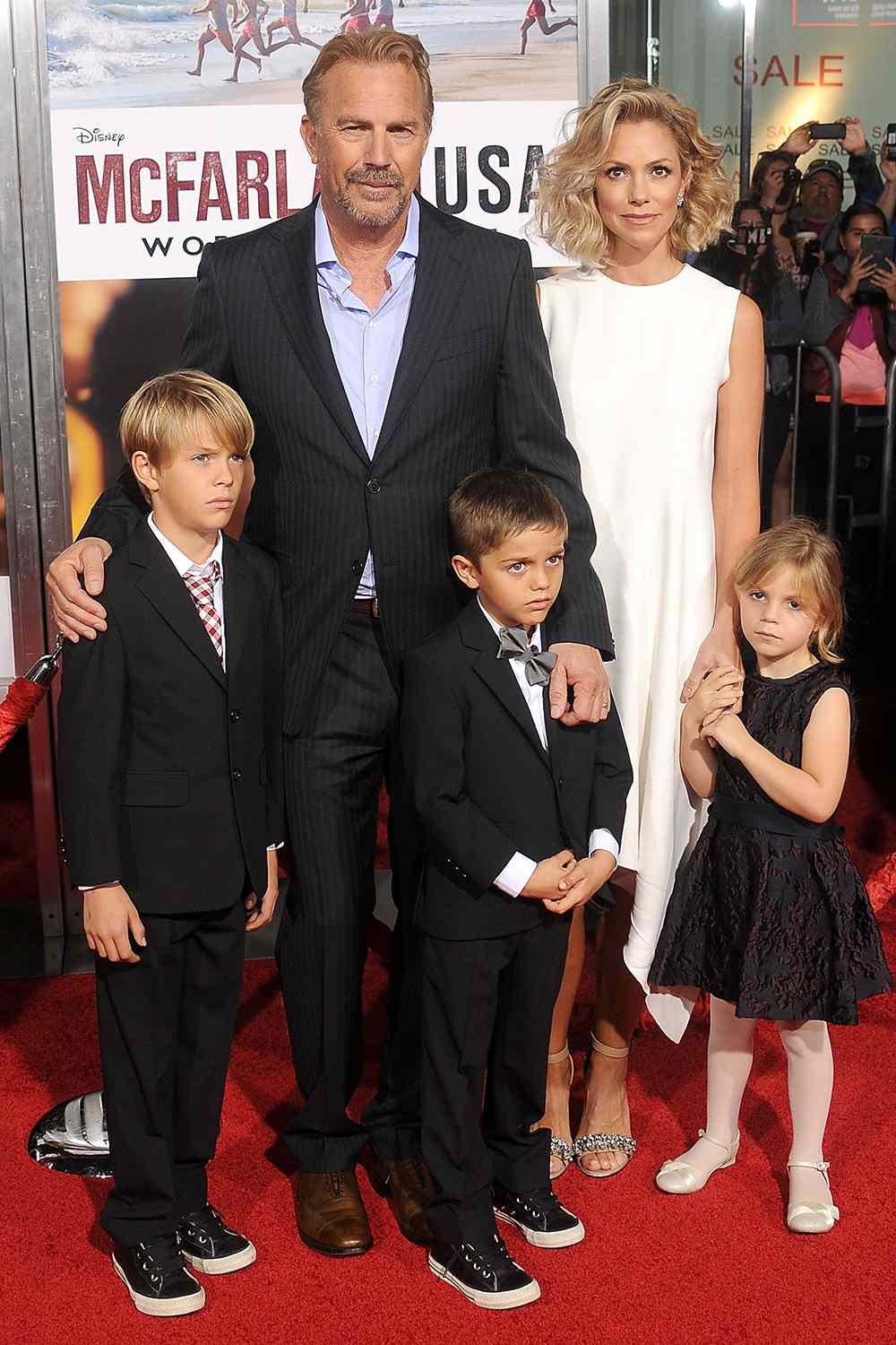 Actor Kevin Costner, wife Christine Baumgartner and children Grace Avery Costner, Hayes Logan Costner and Cayden Wyatt Costner arrive at the World Premiere of Disney's "McFarland, USA" at the El Capitan Theatre on February 9, 2015 in Hollywood, California.