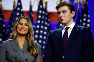 Former first lady Melania Trump and Barron Trump look on as Republican presidential nominee, former U.S. President Donald Trump speaks during an election night event at the Palm Beach Convention Center on November 06, 2024 in West Palm Beach, Florida.