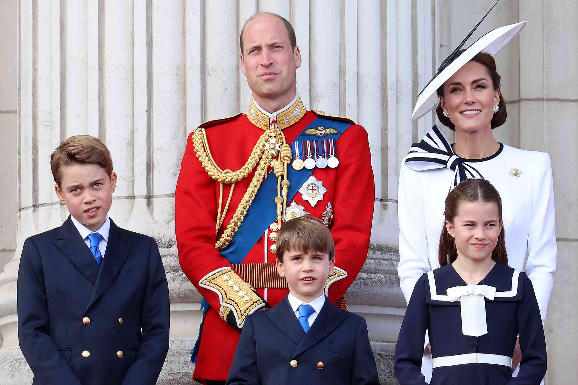 LONDON, ENGLAND - JUNE 15: Prince George of Wales, Prince William, Prince of Wales, Prince Louis of Wales, Princess Charlotte of Wales and Catherine, Princess of Wales during Trooping the Colour at Buckingham Palace on June 15, 2024 in London, England. Trooping the Colour is a ceremonial parade celebrating the official birthday of the British Monarch. The event features over 1,400 soldiers and officers, accompanied by 200 horses. More than 400 musicians from ten different bands and Corps of Drums march and perform in perfect harmony.