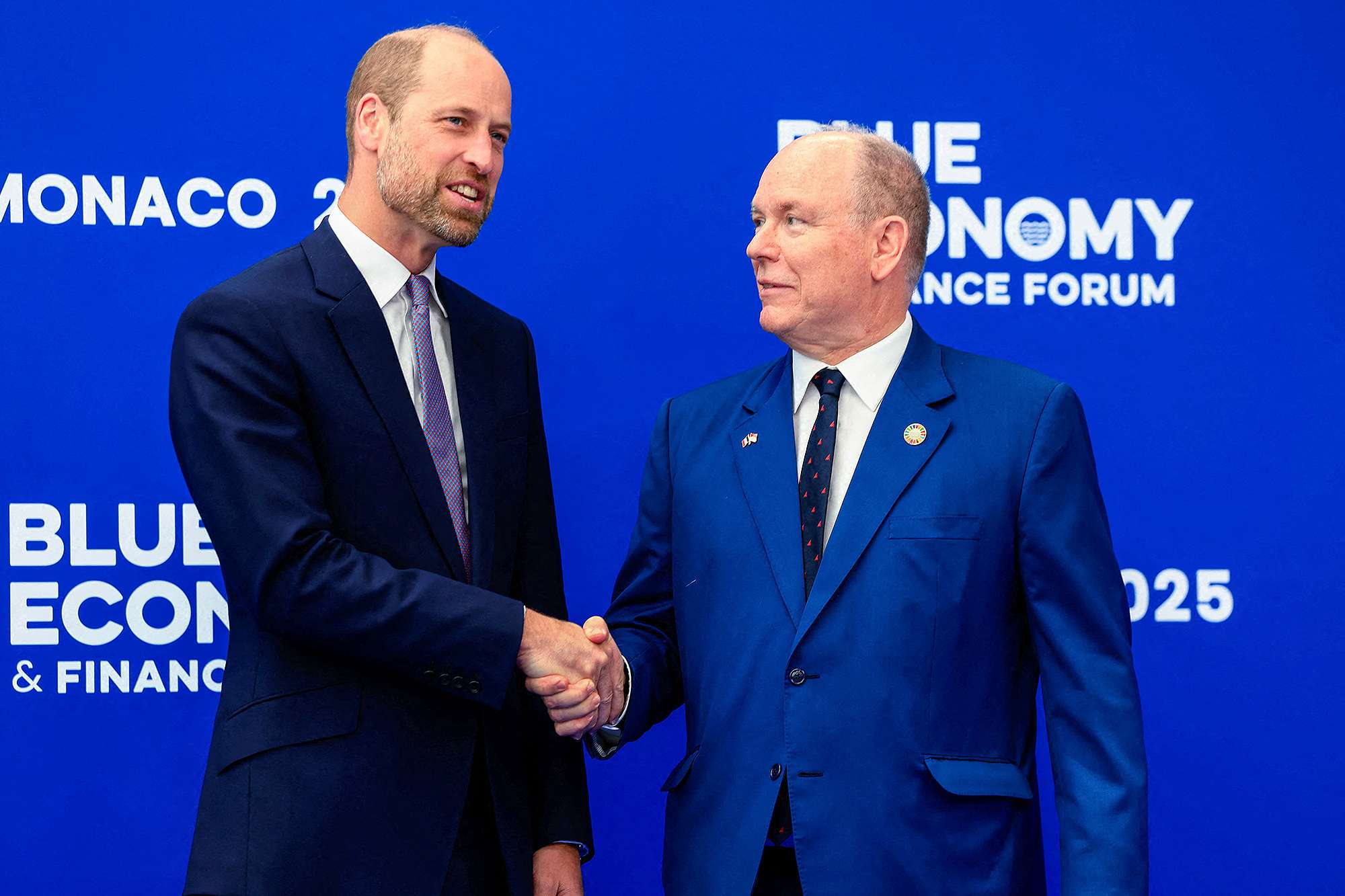 Britain's Prince William, Prince of Wales (L) shakes hands with Prince Albert II of Monaco as they pose for a photograph at the Blue Economy and Finance Forum (BEFF) at The Grimaldi Forum in Monaco on June 8, 2025. World leaders have descended on the French Riviera ahead of a high-level summit to tackle a deepening crisis in the oceans driven by overfishing, climate change and pollution. The United Nations says oceans face an "emergency" and leaders gathering in Nice will be under pressure to commit much-needed money and stronger protections for the ailing seas and the people that depend on them.