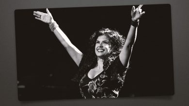Rebekah Del Rio with her arms up