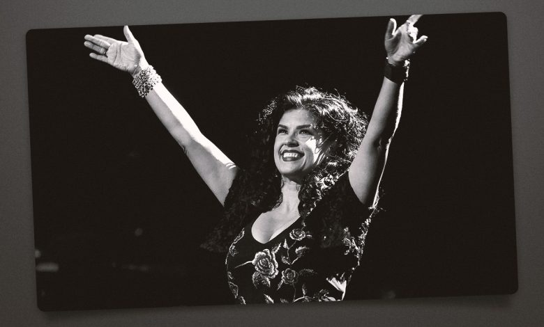 Rebekah Del Rio with her arms up