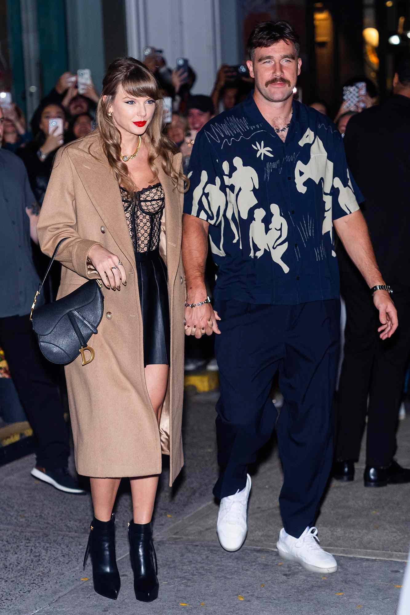 NEW YORK, NEW YORK - OCTOBER 11: Taylor Swift (L) and Travis Kelce are seen in SoHo on October 11, 2024 in New York City. 