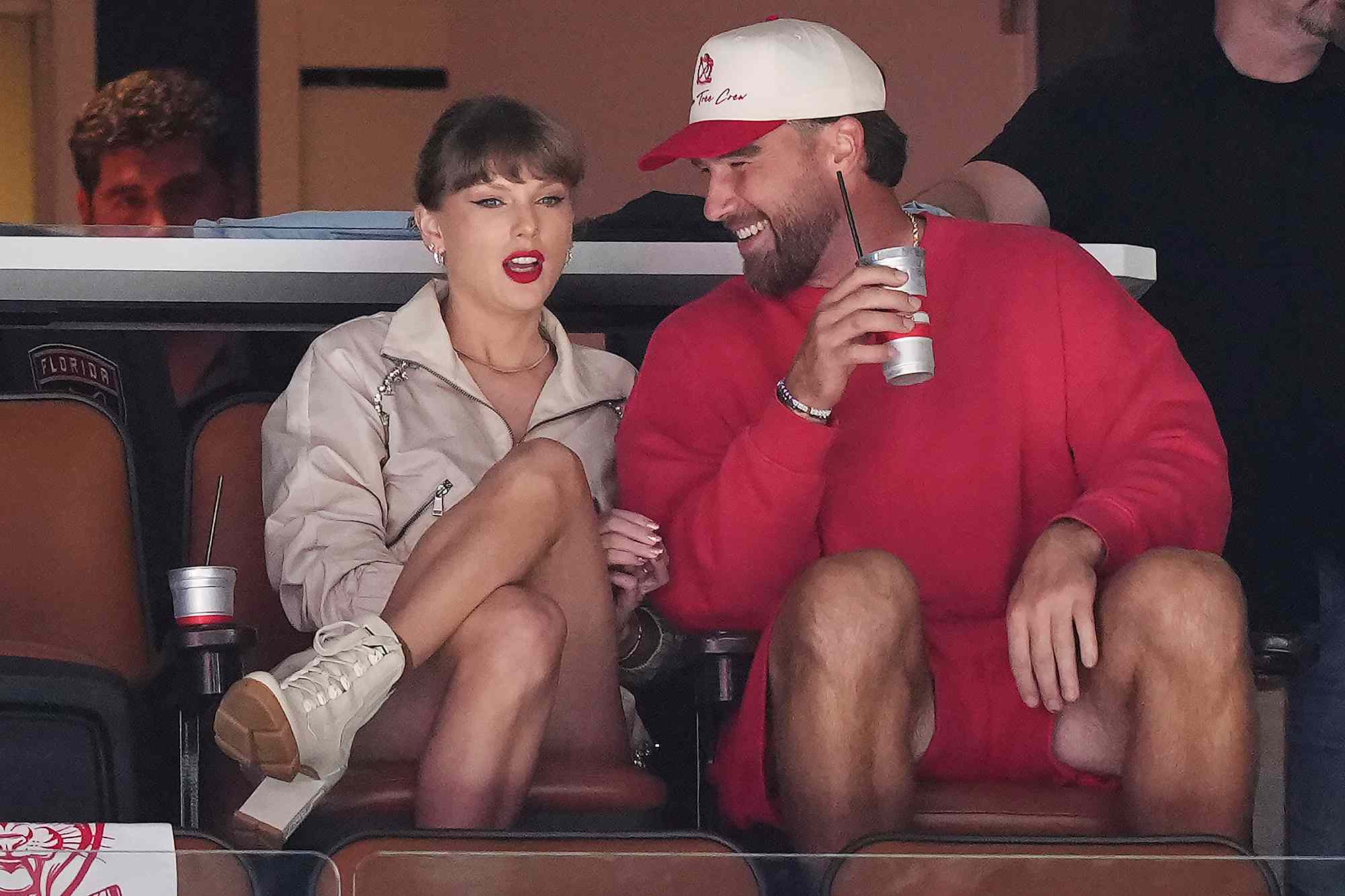 Singer Taylor Swift, front left, and Kansas City Chiefs football player Travis Kelce, front right, take in the third period in Game 4 of the NHL hockey Stanley Cup Final between the Edmonton Oilers and the Florida Panthers in Sunrise, Fla., Thursday, June 12, 2025. 