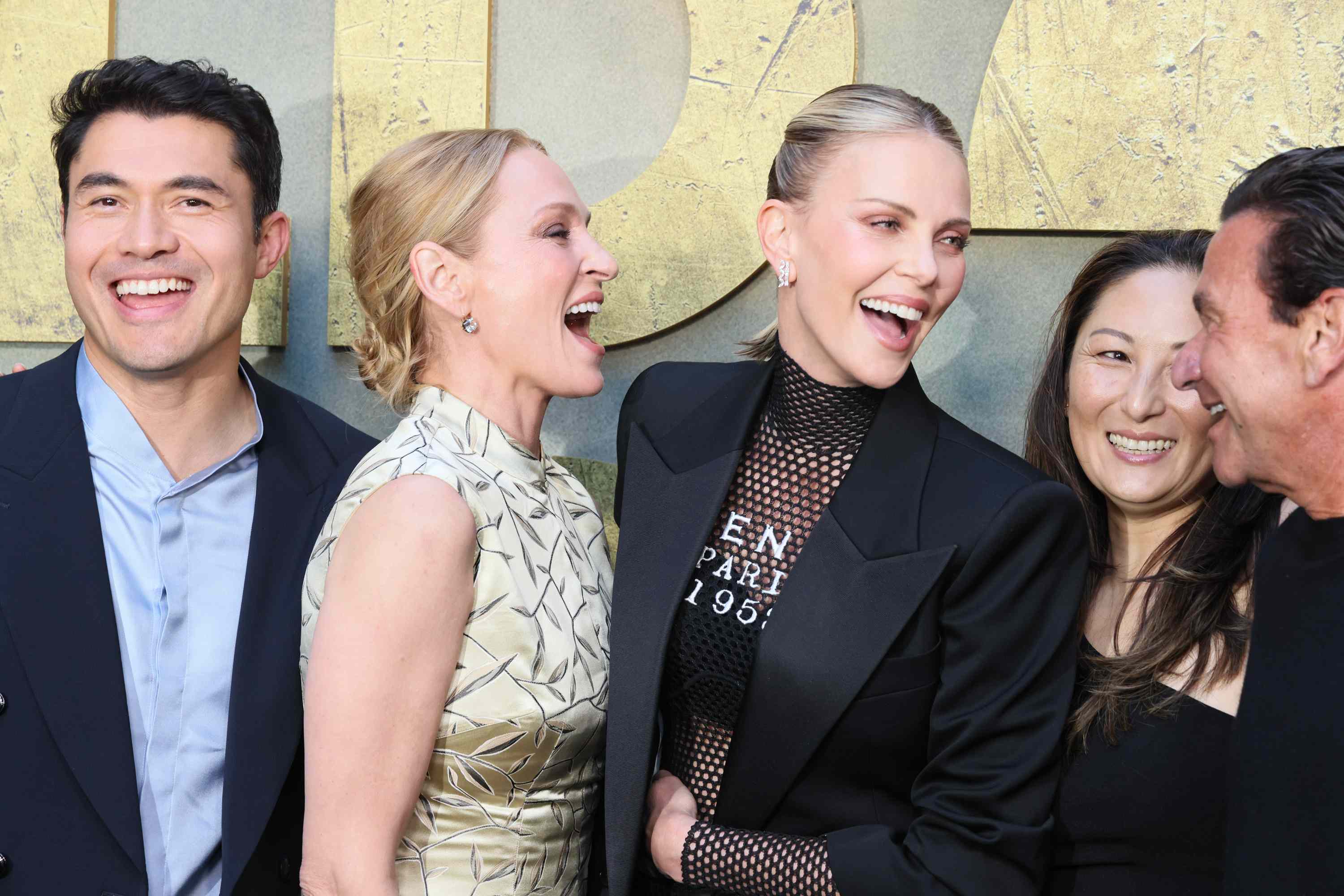 Henry Golding, Uma Thurman, Charlize Theron, Beth Kono, and A.J. Dix attend the Los Angeles Premiere of Netflix's "The Old Guard 2" at Netflix Tudum Theater on June 25, 2025 in Los Angeles, California.