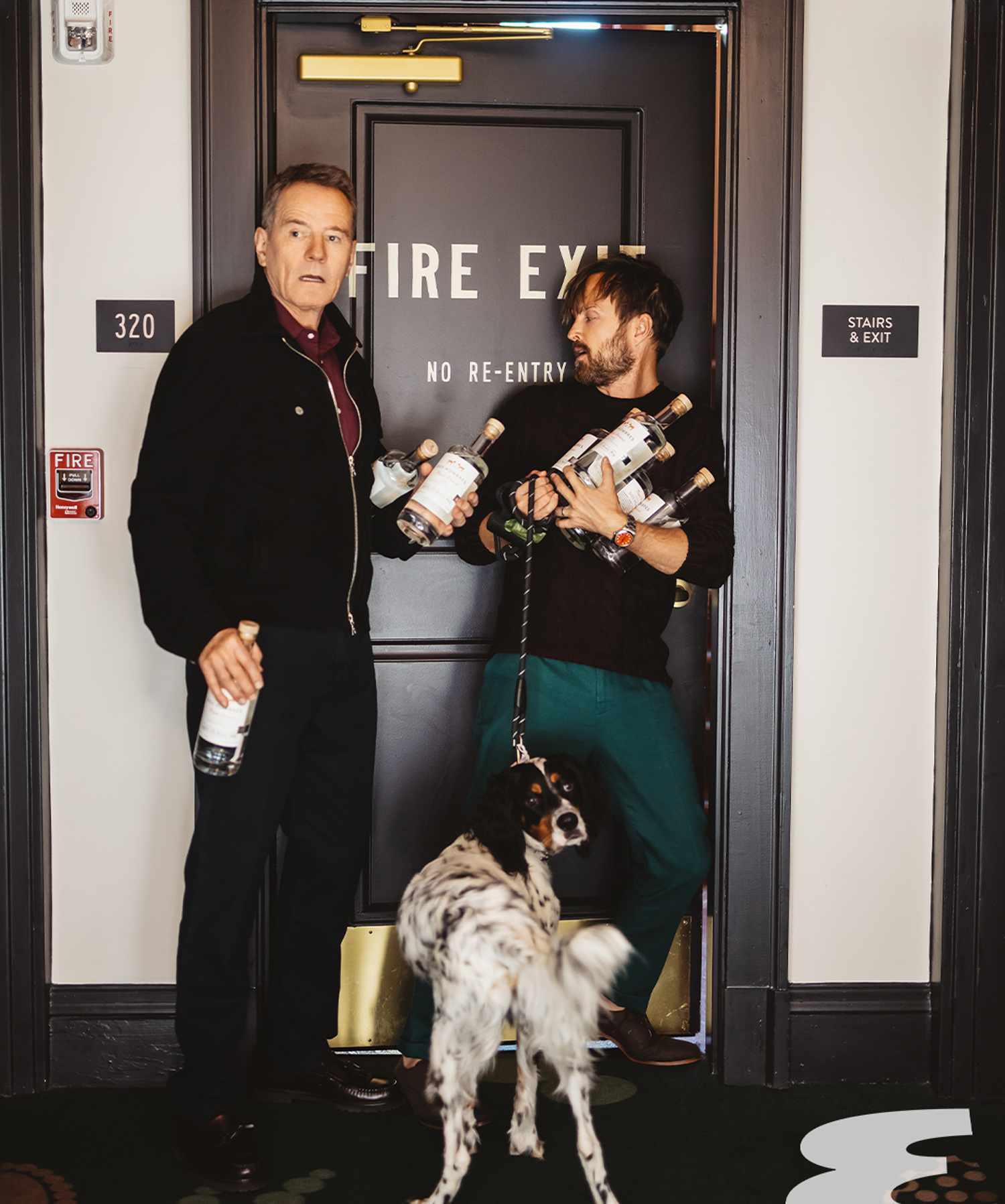 Bryan Cranston and Aaron Paul hold bottles from their Dos Hombres Mezcal brand for an 'Esquire' photoshoot in 2022