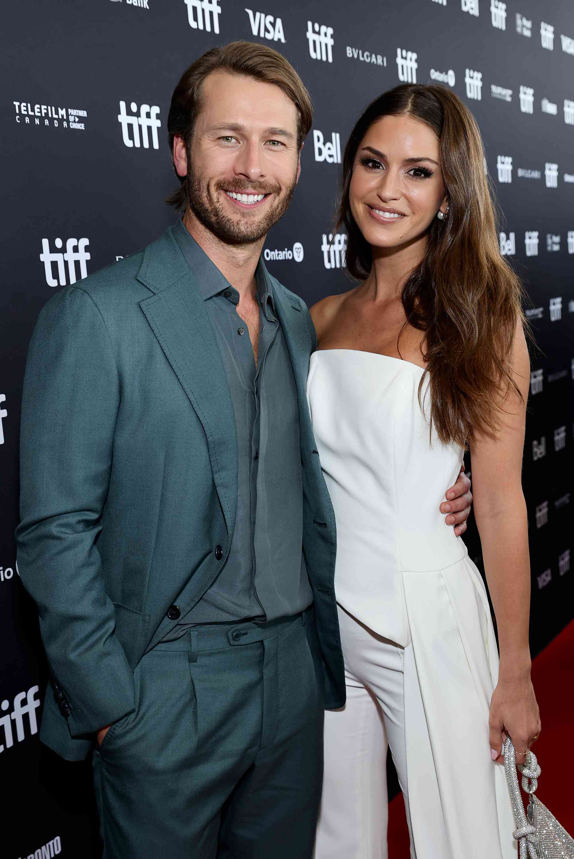 Glen Powell and Gigi Paris attend the "Devotion" Premiere at Cinesphere on September 12, 2022 in Toronto, Ontario.
