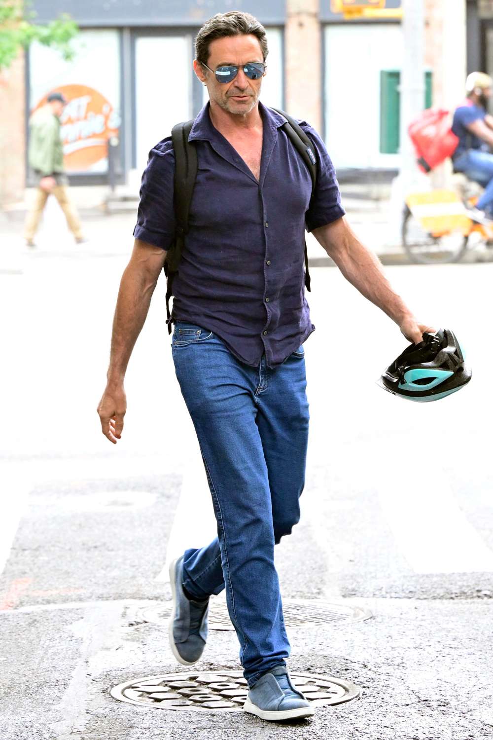 Hugh Jackman is spotted out in New York City. The Australian actor was seen getting ready for a bike ride after leaving the Minetta Lane Theatre.