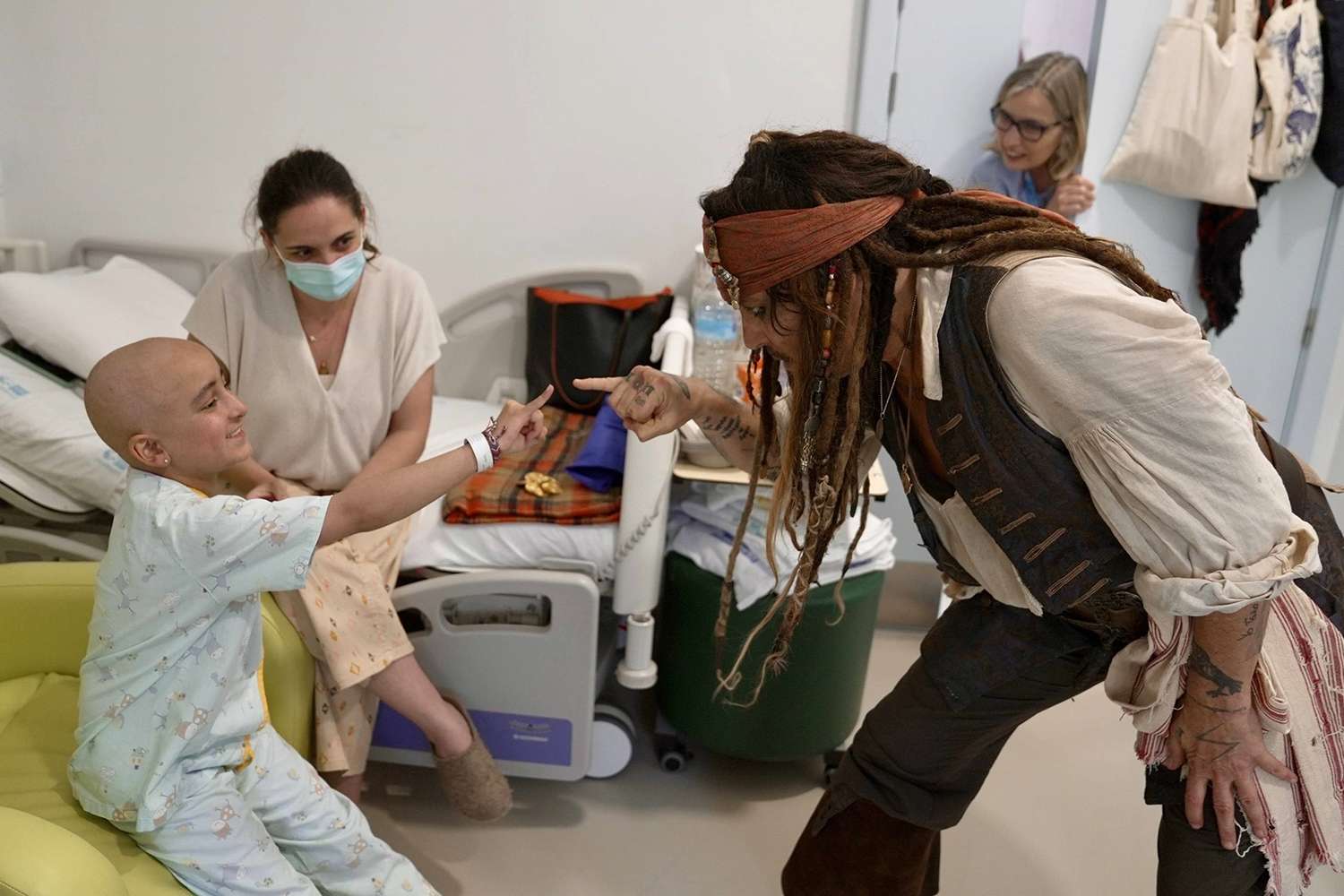 Johnny Depp brings smiles to young patients at the NiÃ±o JesÃºs Public Children's Hospital in Madrid, visiting them dressed as his iconic character, Jack Sparrow.