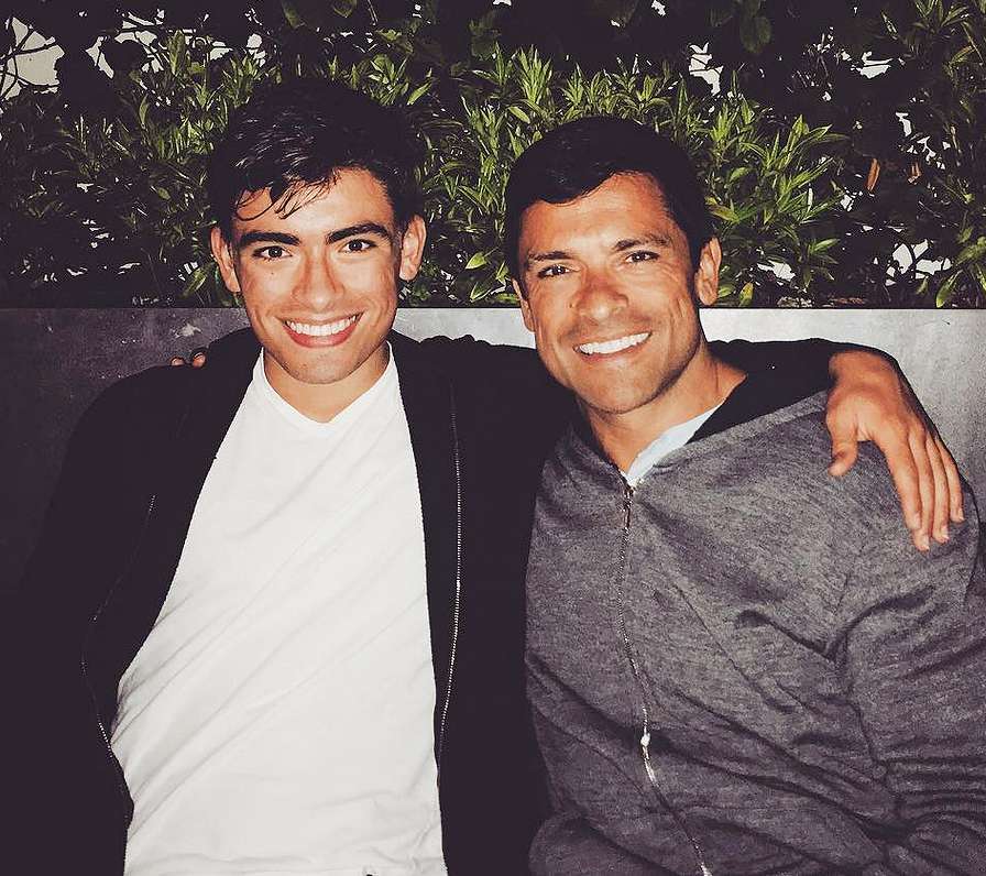 Michael Consuelos and Mark Consuelos pose together in 2016