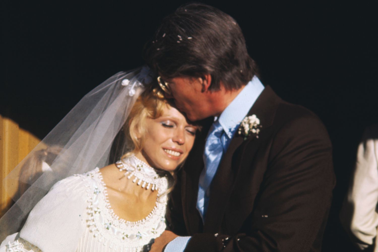Nancy Sinatra and her new husband, producer choreographer Hugh Lambert, pose for photographers as they leave St. Louis Catholic Church after their wedding ceremony. It is the second marriage for both.