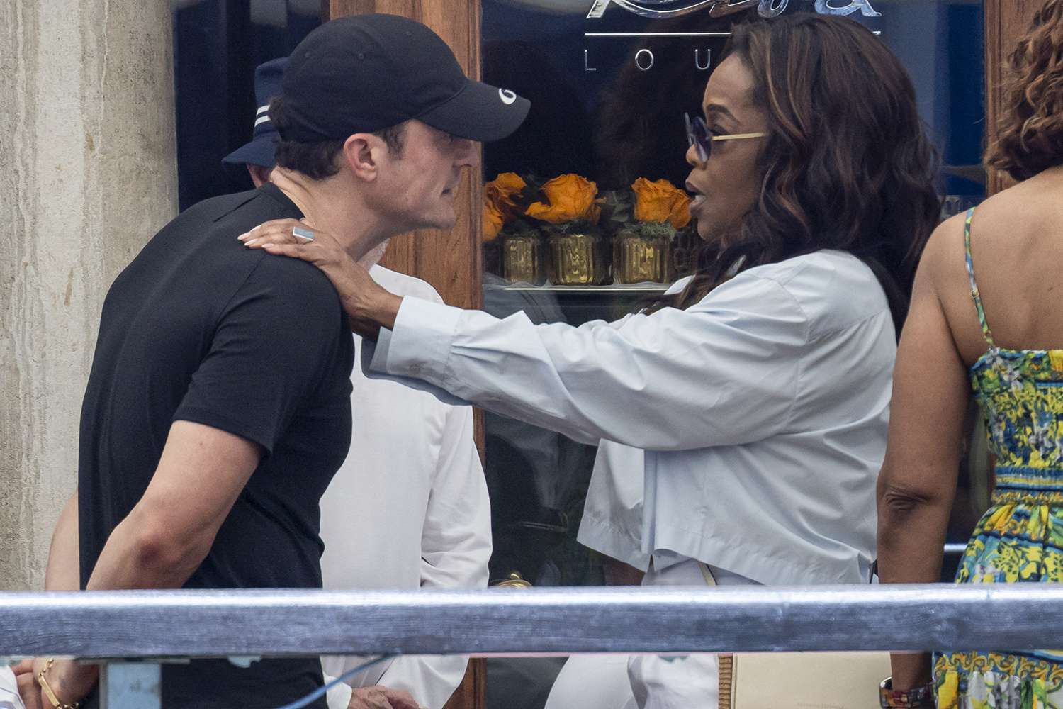 Orlando Bloom, Oprah Winfrey are chatting with some friends at Gritti Hotel at ahead of the wedding of Jeff Bezos and Lauren Sanchez