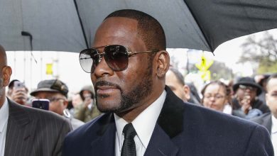 R. Kelly wearing glasses