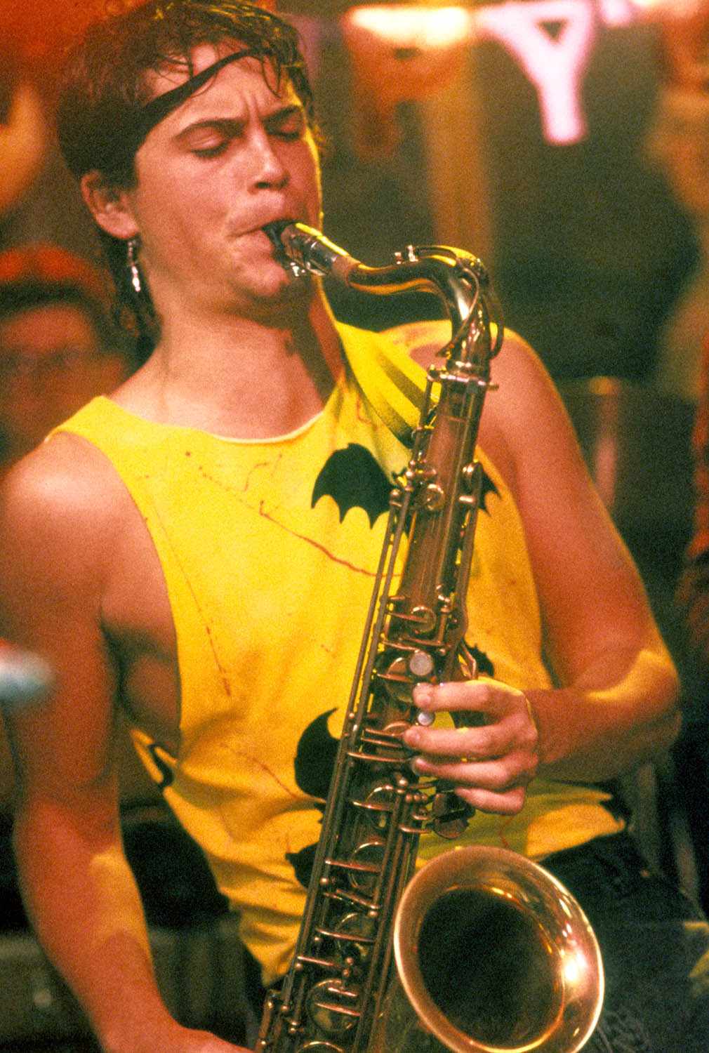 Rob Lowe plays saxophone in a scene from the film 'St. Elmo's Fire', 1985.