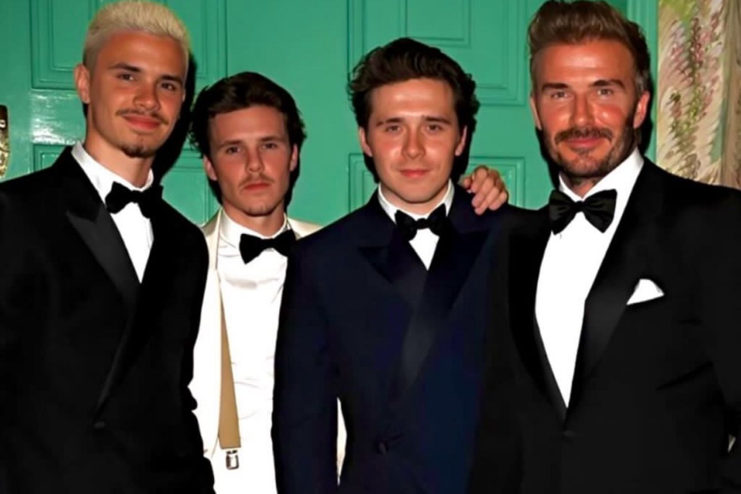 Romeo Beckham, Cruz Beckham, Brooklyn Beckham and David Beckham pose in suits in an Instagram photo Cruz shared on Sept. 1, 2024