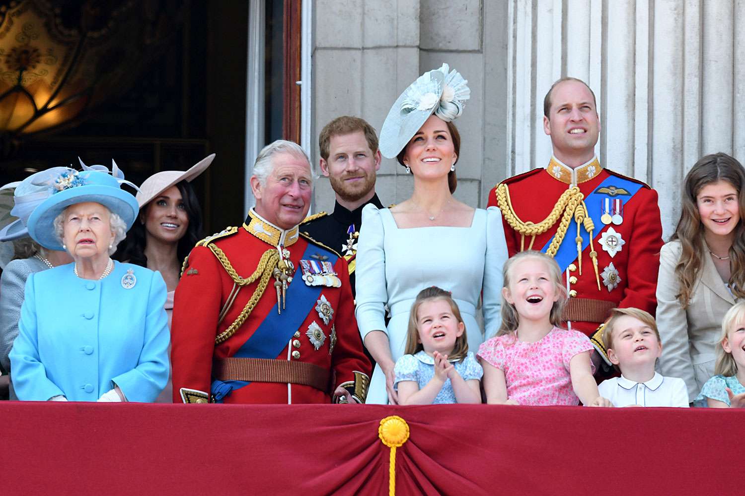 Queen Elizabeth II, Prince Charles, Prince of Wales, Meghan, Duchess of Sussex, Prince Harry, Duke of Sussex, Catherine, Duchess of Cambridge, Prince William, Duke of Cambridge, Princess Charlotte of Cambridge, Savannah Phillips and Prince George of Cambridge on the balcony of Buckingham Palaceduring Trooping The Colour 2018 at The Mall on June 9, 2018 in London, England. The annual ceremony involving over 1400 guardsmen and cavalry, is believed to have first been performed during the reign of King Charles II. The parade marks the official birthday of the Sovereign, even though the Queen's actual birthday is on April 21st. 