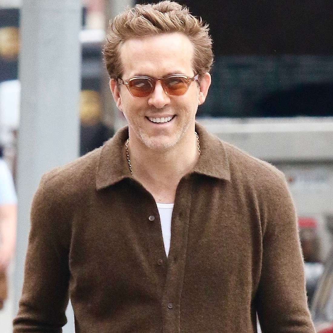 Ryan Reynolds is all smiles during a stroll with two female companions in Downtown Manhattan.