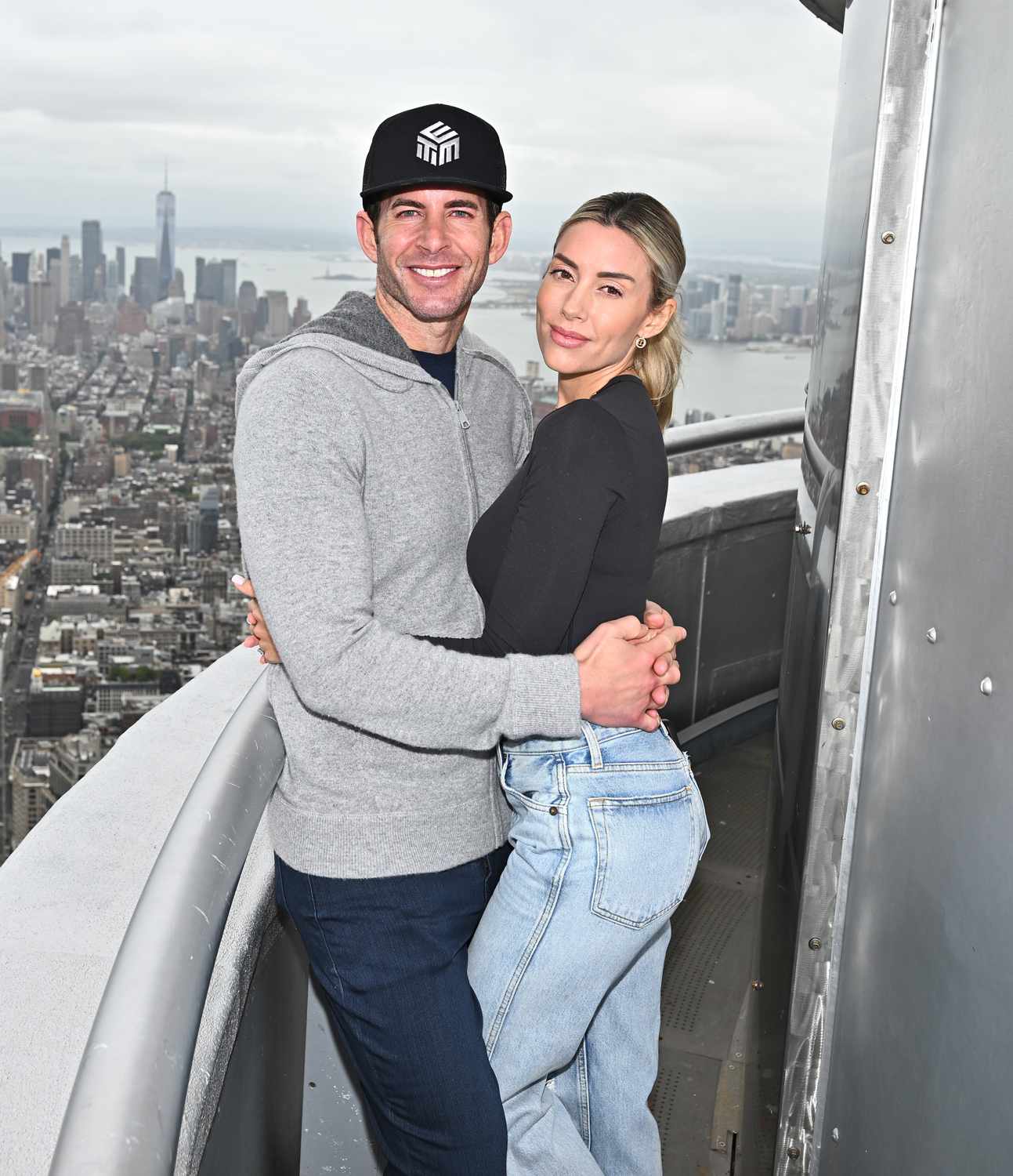  Tarek El Moussa and Heather Rae El Moussa visit the Empire State Building on September 25, 2024 in New York City.
