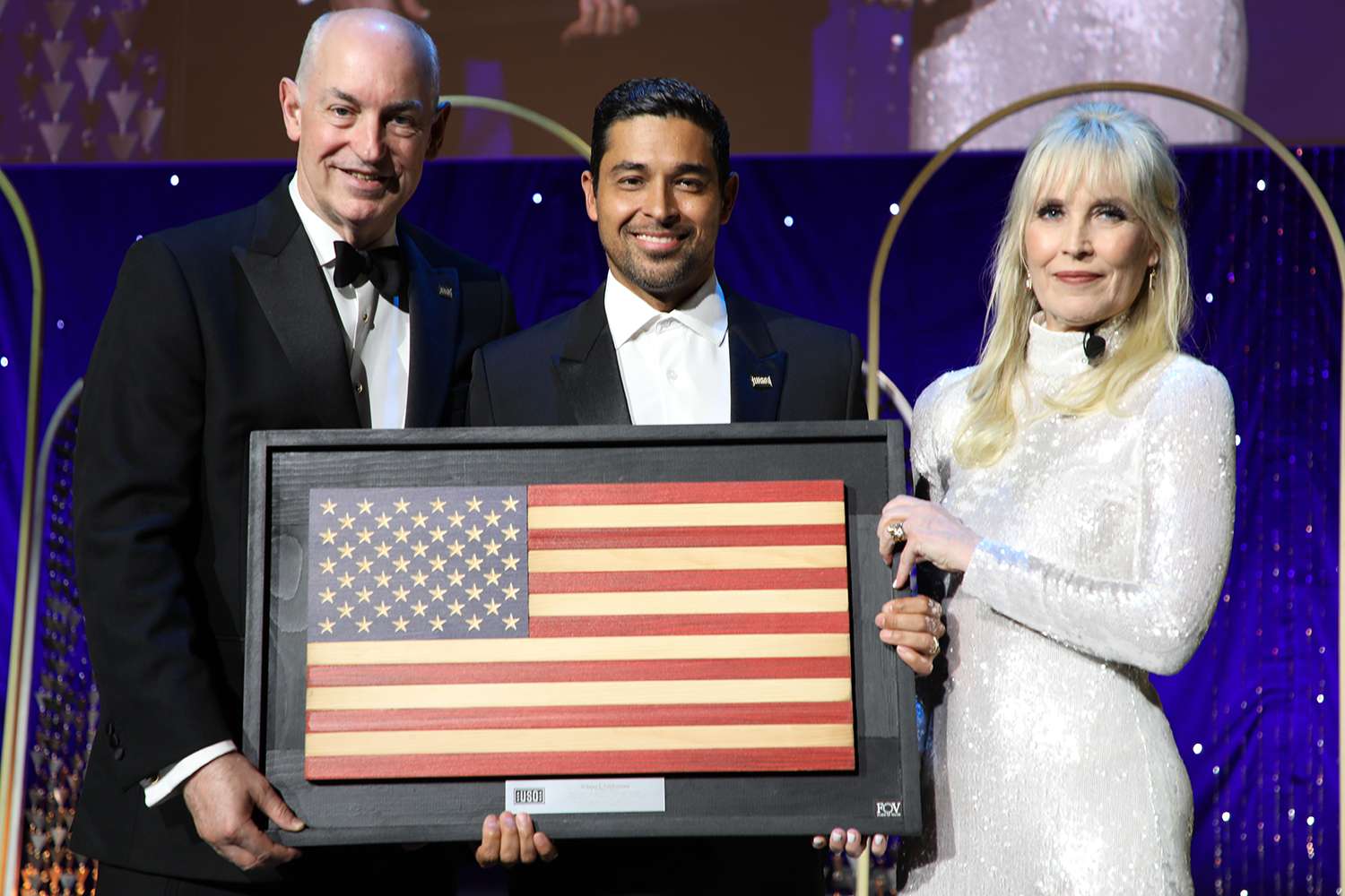 Wilmer Valderrama, USO CEO and President DJ Crouch, and USO SE Regional President Lisa Marie Riggins at the USO annual gala
