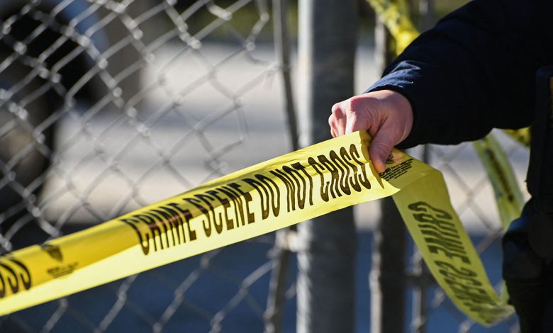 Police tape at a crime scene.