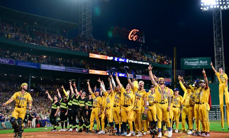 Members of the Savannah Bananas and The Firefighters wave to fans after their game at Fenway Park on July 05, 2025 in Boston, Massachusetts.