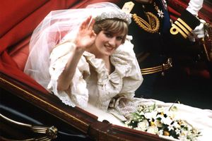 The Prince and Princess of Wales return to Buckingham Palace by carriage after their wedding, 29th July 1981. She wears a wedding dress by David and Elizabeth Emmanuel and the Spencer family tiara
