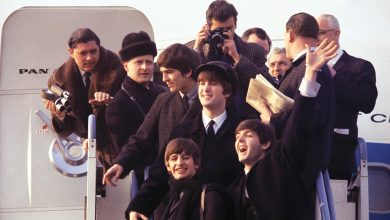 (L-R) George Harrison, Ringo Starr, John Lenon, and Paul Mccartney arriving at JFK airport in