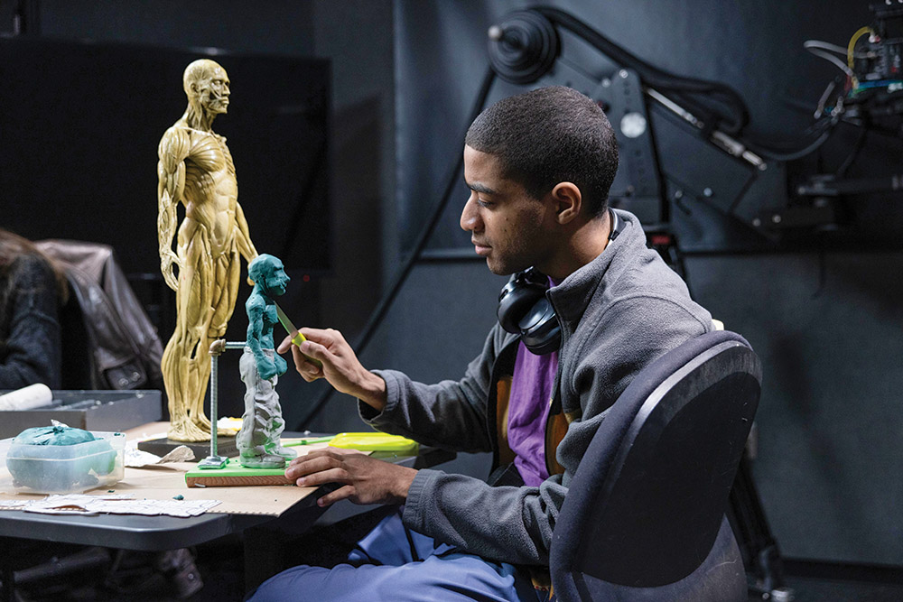 A student in Emerson’s Sculpting and Animation class works on a sculpture in the Engagement Media Lab.