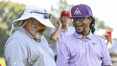 Comedian Micah Katt Williams laughs with PGA TOUR LIVE analyst Michael Collins during the first round of the TOUR Championship, the final event of the FedExCup Playoffs, at East Lake Golf Club on August 29, 2024 in Atlanta, Georgia.