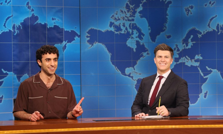Emil Wakim (left) with anchor Colin Jost during Weekend Update on the April 12 episode.