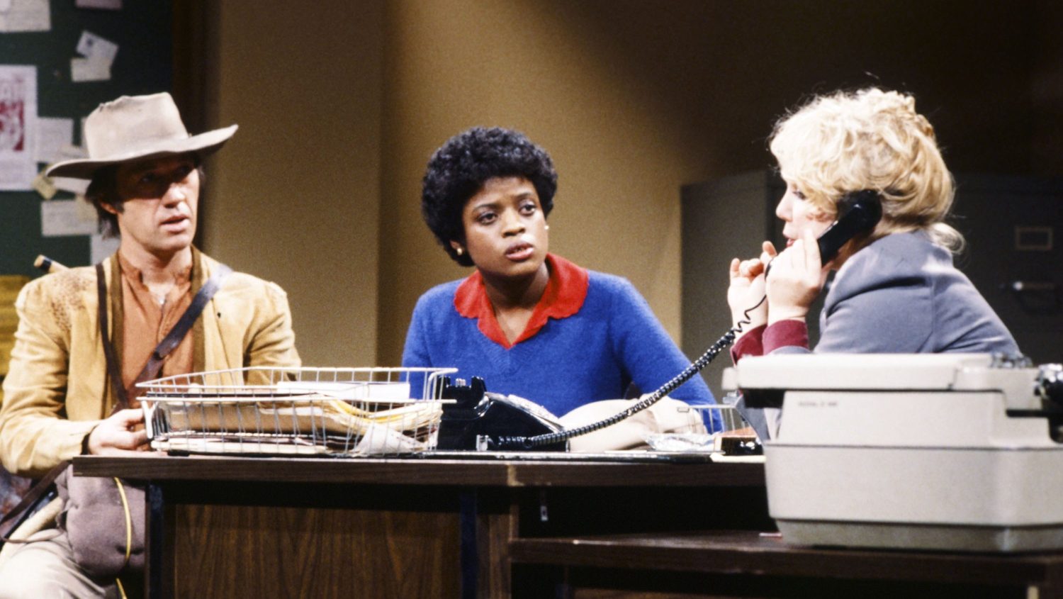 David Carradine as Caine, Yvonne Hudson as Ms. Robley, Denny Dillon as Counselor during the 'Welfare Counseling' skit on December 20, 1980  SNL