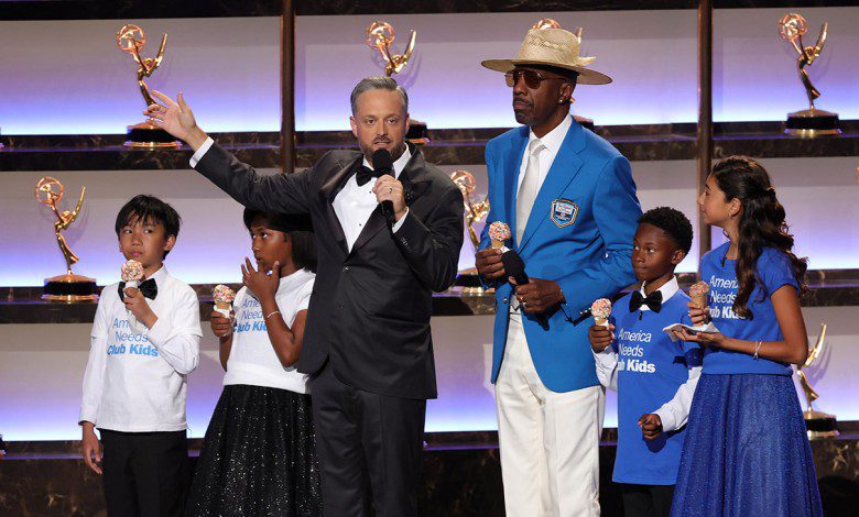 (Center L-R) Host Nate Bargatze and J. B. Smoove speak onstage during the 77th Primetime Emmy Awards at Peacock Theater on September 14, 2025 in Los Angeles, California.