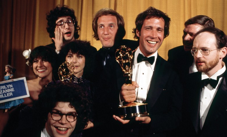 Clockwise from top left: Saturday Night’s Emmy-winning writers Tom Davis, Alan Zweibel, Chevy Chase, director Dave Wilson, Michael O’Donoghue, Al Franken, Anne Beatts and Rosie Shuster.