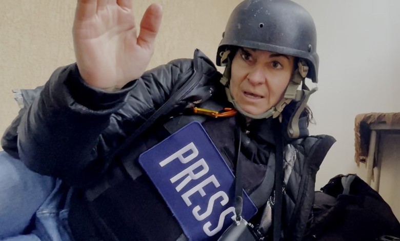 Lynsey Addario finds shelter from a nearby shelling during an assignment in Ukraine in Love + War