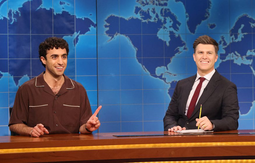 Emil Wakim (left) with anchor Colin Jost during Weekend Update on the April 12 episode.