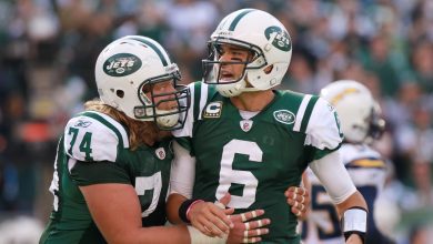 EAST RUTHERFORD, NJ - OCTOBER 23: Mark Sanchez #6 of the New York Jets is congratulated on a touchdown pass by teammate Nick Mangold #74 against the San Diego Chargers at MetLife Stadium on October 23, 2011 in East Rutherford, New Jersey. (Photo by Nick Laham/Getty Images)