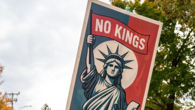 SHELBURNE, VERMONT - OCTOBER 18: Protestors march in the second No Kings protest on October 18, 2025 in Shelburne, Vermont. Organizers expect millions to participate in cities and towns across the nation for the second