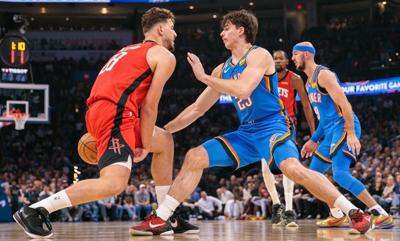 Brooks Barnhizer 23 of the Oklahoma City Thunder guards Alperen Sengun 28 of the Houston Rockets during the first half at Paycom Center on October 21, 2025 in Oklahoma City, Oklahoma.