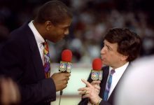 17 May 1992: NBC sportscaster Marv Albert and Earvin Magic Johnson talk during a game between the Chicago Bulls and the New York Knicks at the United Center in Chicago, Illinois.