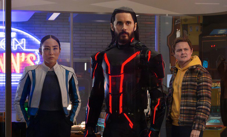 (L-R) Greta Lee as Eve Kim, Jared Leto as Ares, and Arturo Castro as Seth Flores in Tron: Ares