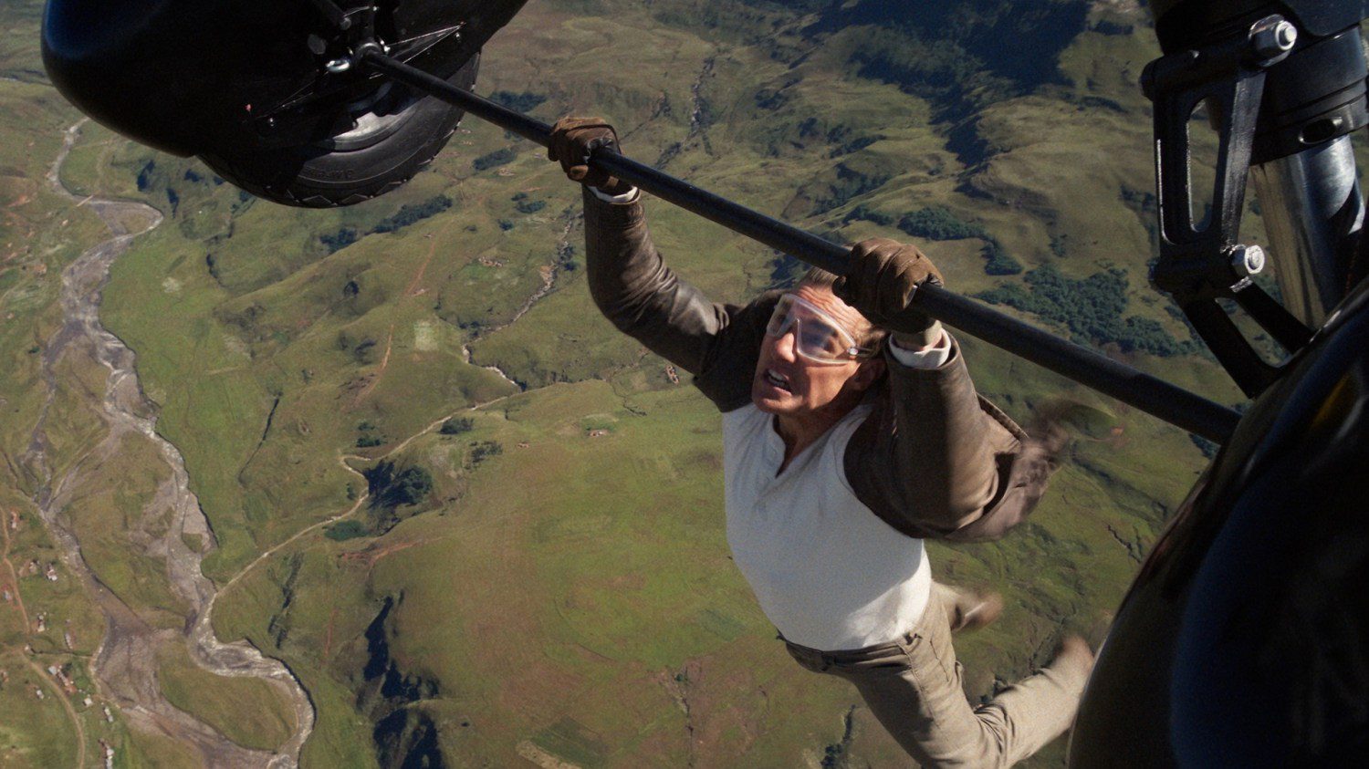 Tom Cruise hanging off a plane in 'Mission: Impossible — The Final Reckoning'.