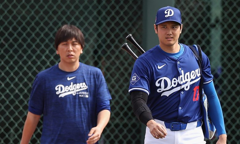 Shohei Ohtani #17 of the Los Angeles Dodgers and interpreter Ippei Mizuhara arrive to a game against the Chicago White Sox at Camelback Ranch on February 27, 2024 in Glendale, Arizona.